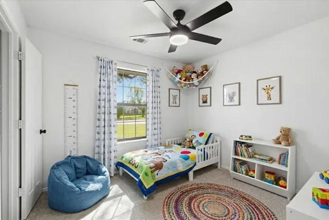 a bedroom with a bed and a couch