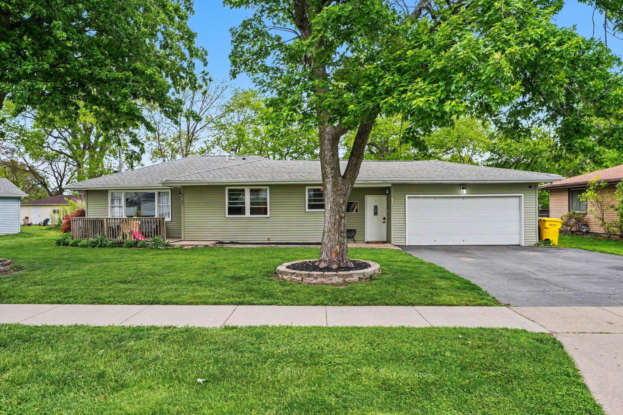 835 North Indiana Street Griffith, IN 46319 - Photo 1 of 19 a front view of a house with a garden