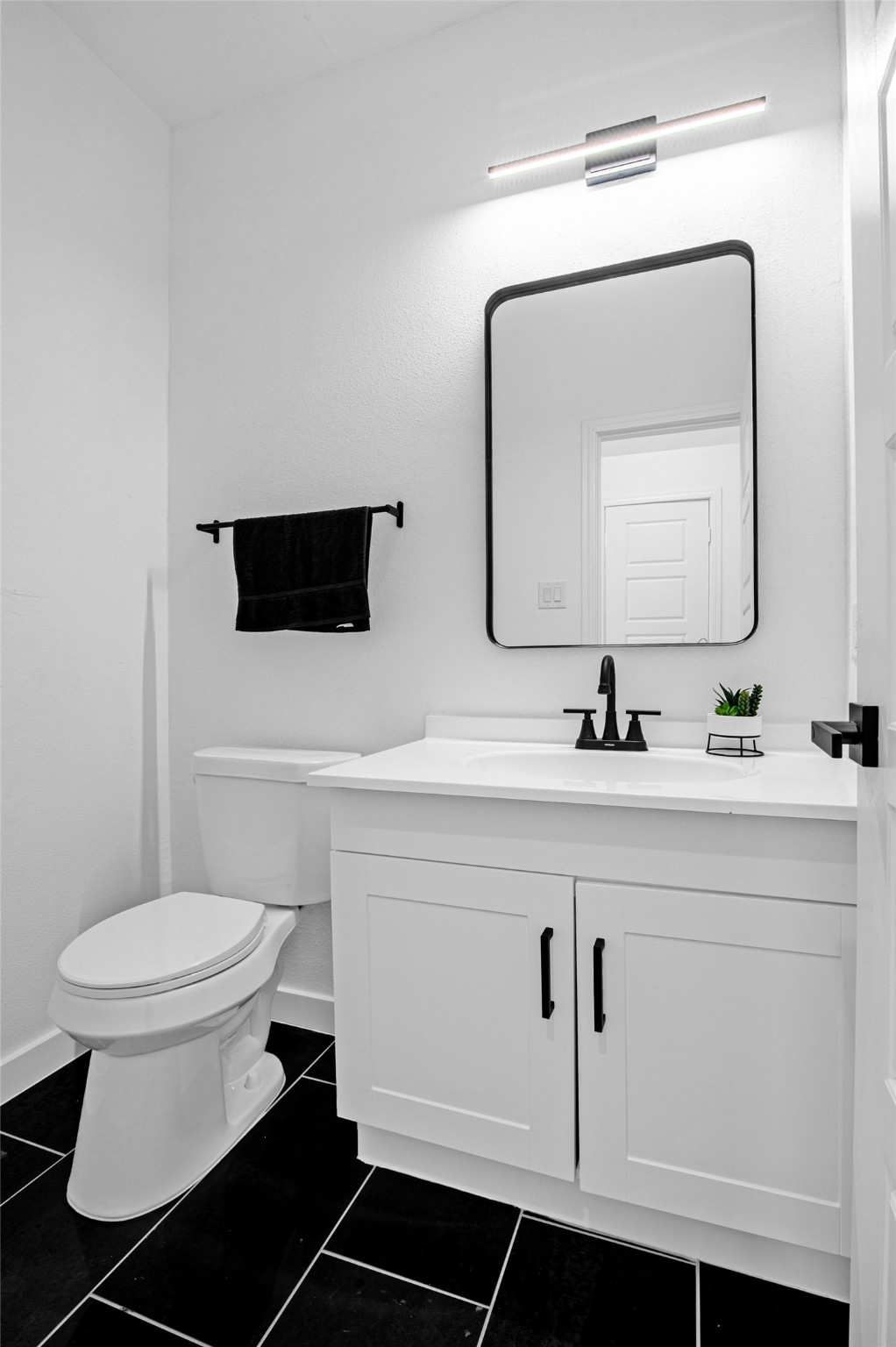 9708 Stedman Street, Unit A Houston, TX 77029 - Photo 9 of 18 A stylish half bath offering added convenience for guests and everyday living.