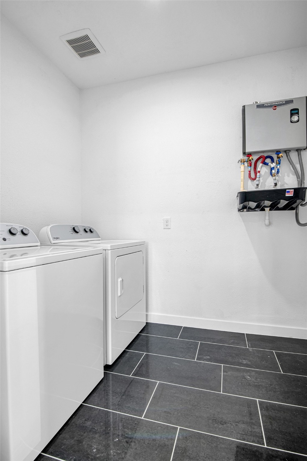 9708 Stedman Street, Unit A Houston, TX 77029 - Photo 10 of 18 A dedicated laundry room complete with a brand-new washer and dryer for effortless daily living.