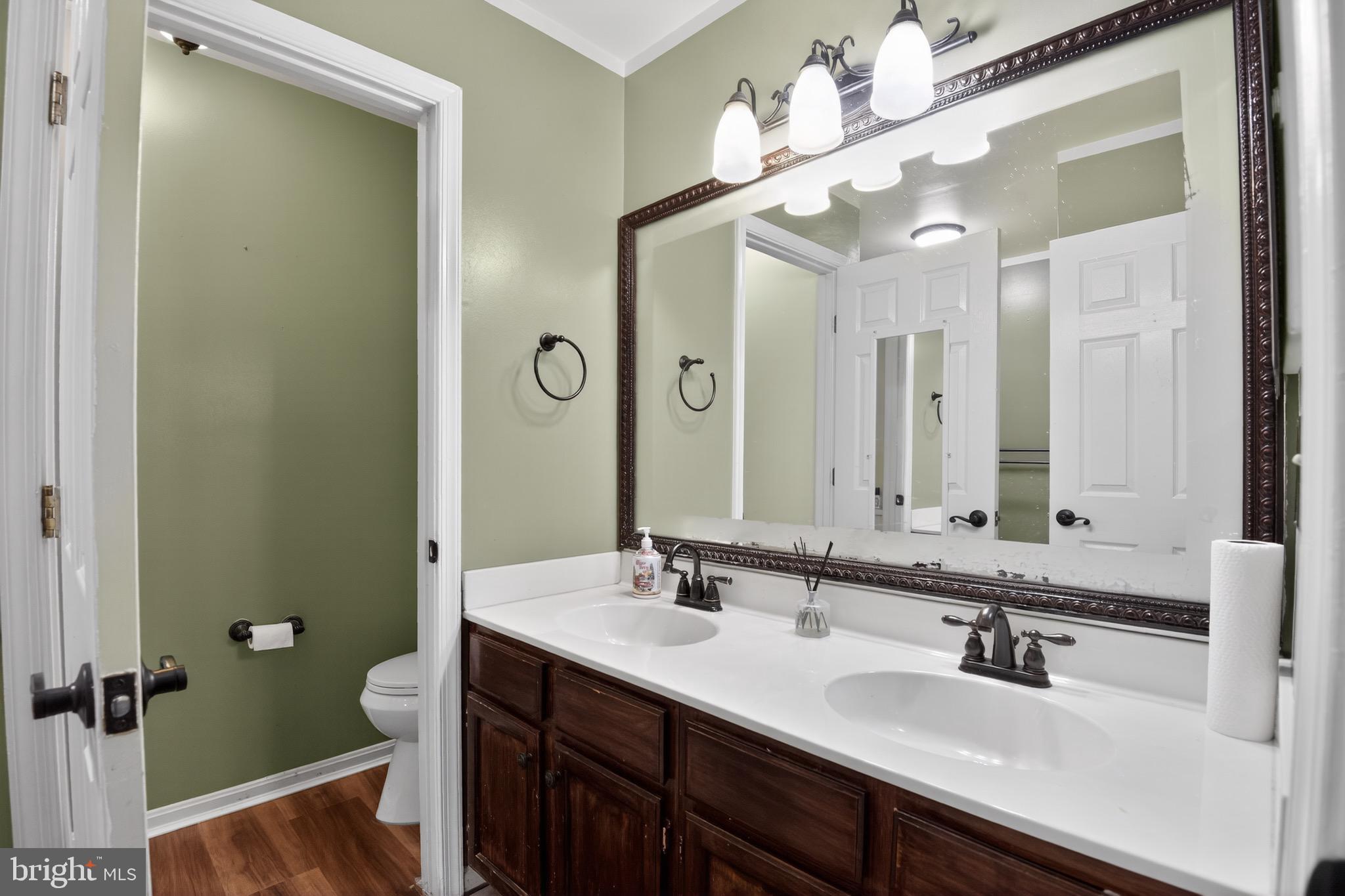226 Finch Way Newark, DE 19702 - Photo 20 of 30 a bathroom with a double vanity sink mirror and double