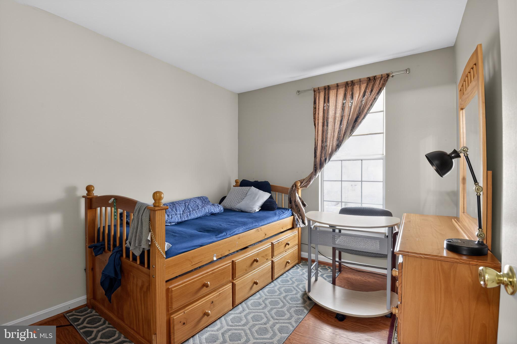 226 Finch Way Newark, DE 19702 - Photo 22 of 30 a bedroom with a bed and a window
