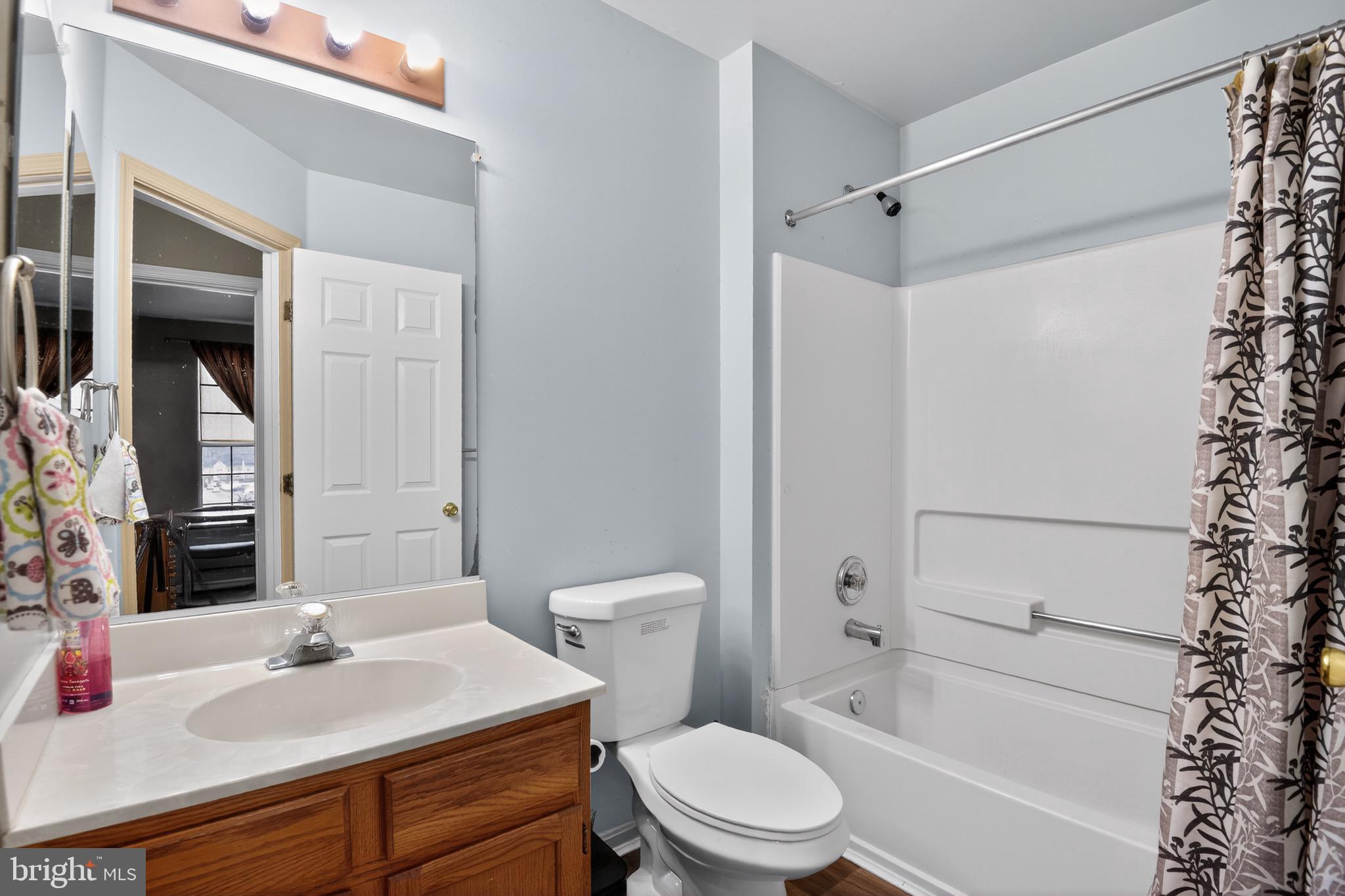 226 Finch Way Newark, DE 19702 - Photo 23 of 30 a bathroom with a sink toilet vanity and shower