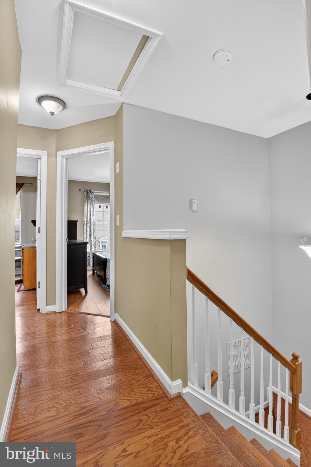 226 Finch Way Newark, DE 19702 - Photo 24 of 30 a view of a hallway with wooden floor and staircase