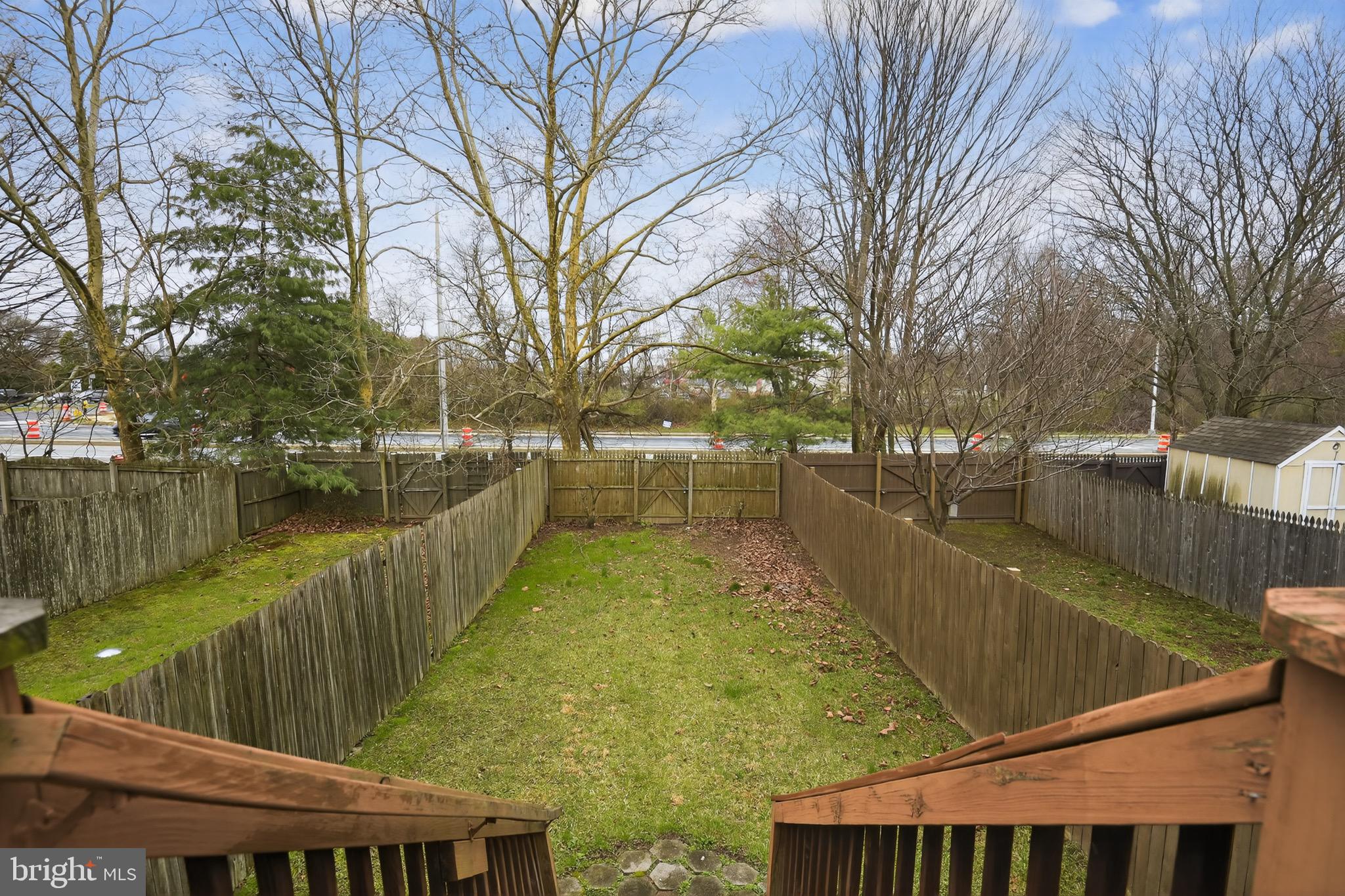 226 Finch Way Newark, DE 19702 - Photo 28 of 30 a view of a lake with couches and wooden fence