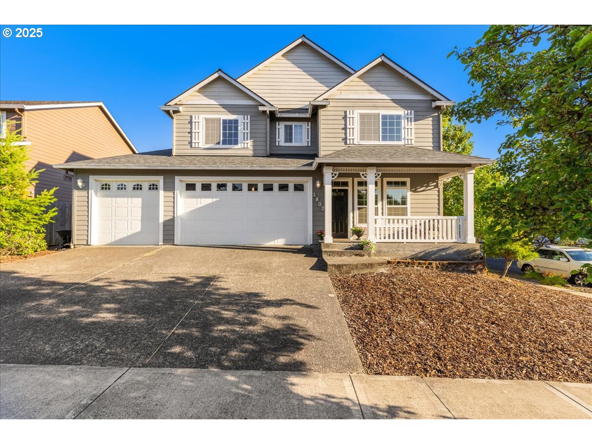 1807 North 8th Way Ridgefield, WA 98642 - Photo 1 of 44 a front view of a house with a yard