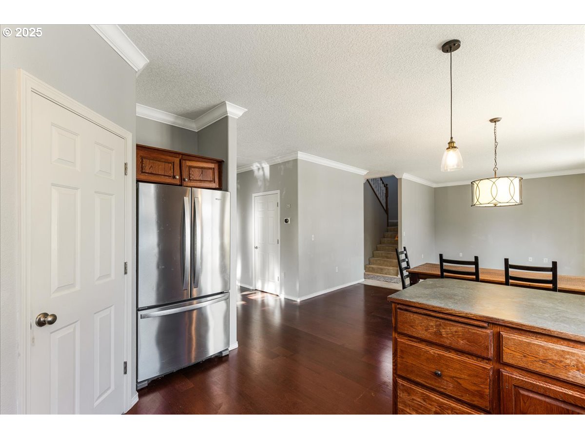 1807 North 8th Way Ridgefield, WA 98642 - Photo 11 of 44 a kitchen with stainless steel appliances granite countertop a refrigerator a sink and a stove