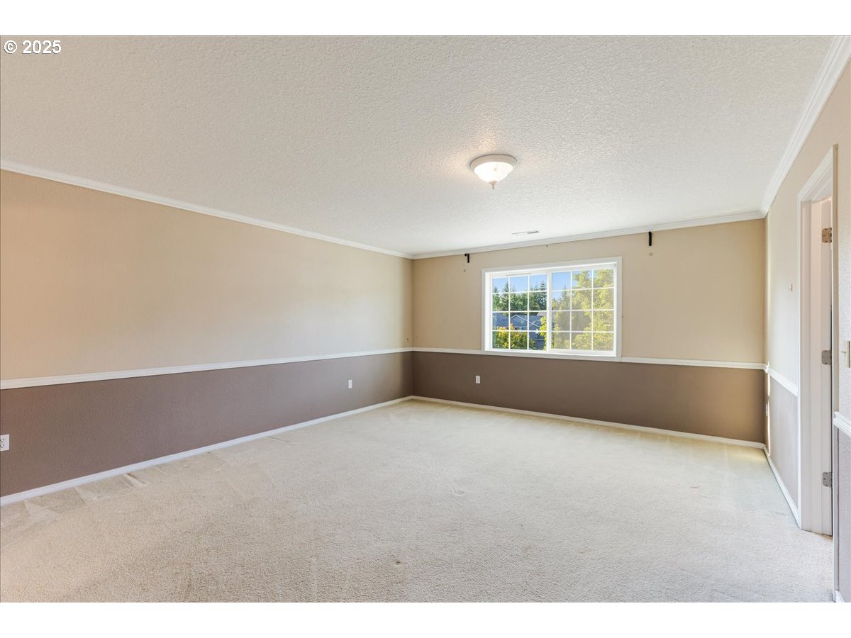 1807 North 8th Way Ridgefield, WA 98642 - Photo 18 of 44 a view of an empty room with a window