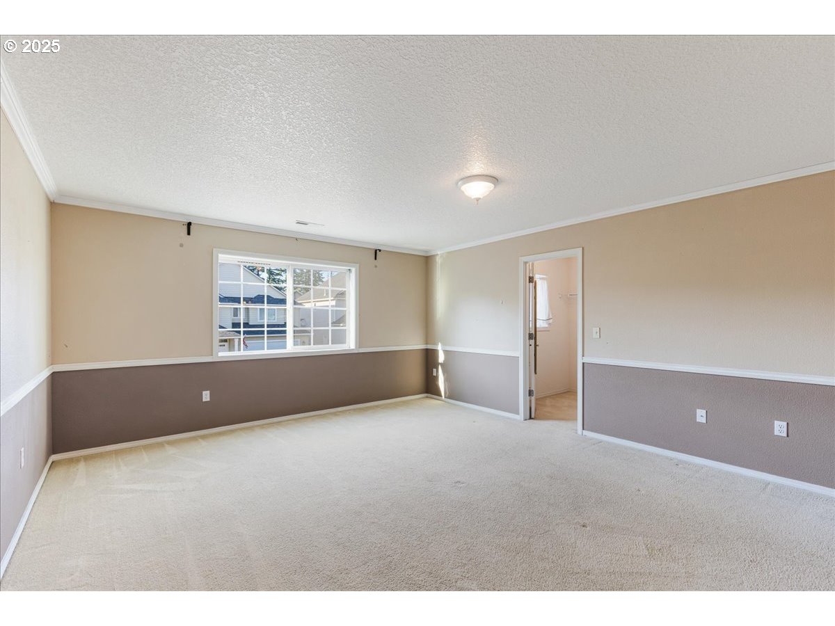 1807 North 8th Way Ridgefield, WA 98642 - Photo 19 of 44 a view of an empty room with a window