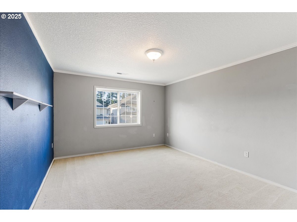 1807 North 8th Way Ridgefield, WA 98642 - Photo 23 of 44 a view of an empty room with a window