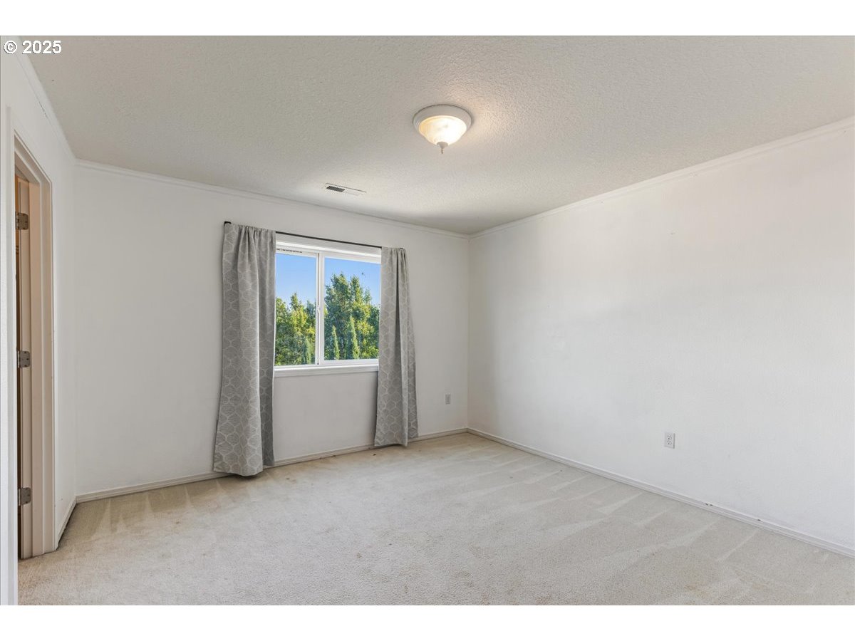 1807 North 8th Way Ridgefield, WA 98642 - Photo 29 of 44 a view of an empty room with a window