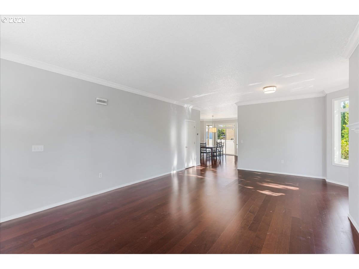 1807 North 8th Way Ridgefield, WA 98642 - Photo 6 of 44 a view of an empty room with wooden floor