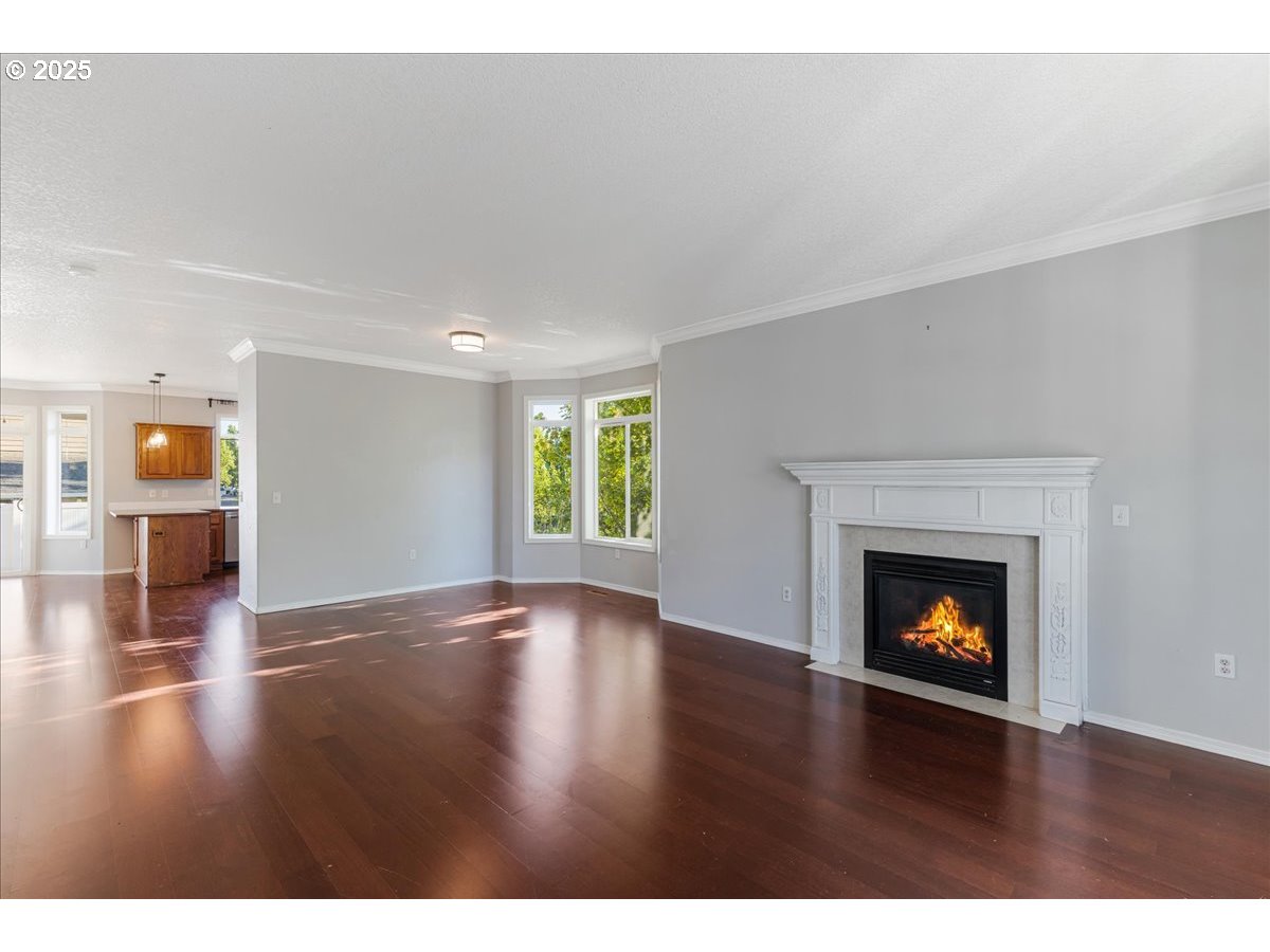 1807 North 8th Way Ridgefield, WA 98642 - Photo 7 of 44 a view of an empty room with window and fire place