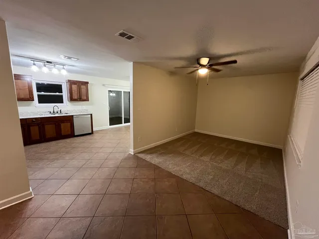 a view of a kitchen with a sink and a microwave