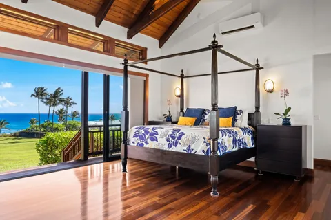 a bedroom with wooden floor