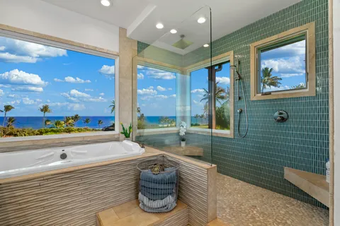 a bathroom with a granite countertop toilet sink and mirror