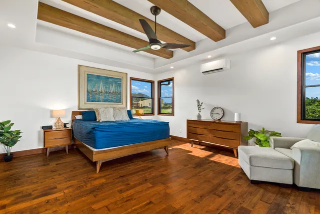 a bathroom with a double vanity sink a mirror and bathtub