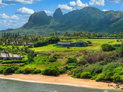 a view of a town with swimming pool and green space