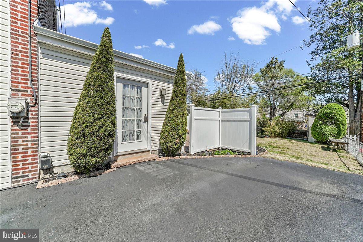 755 Braxton Road Ridley Park, PA 19078 - Photo 22 of 27 Charming entryway with lush greenery.
