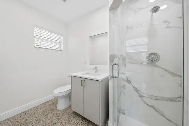 a view of a kitchen cabinets and a room