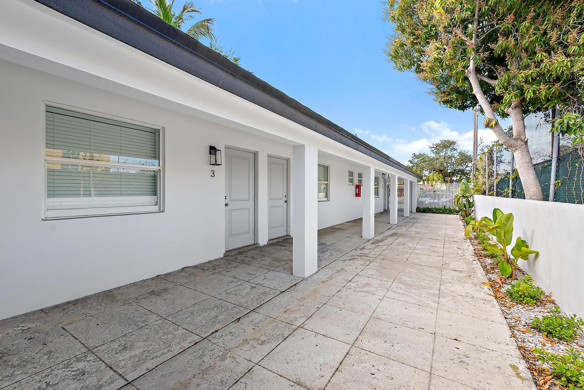 3808 Broadway Avenue West Palm Beach, FL 33407 - Photo 14 of 34 a view of a house with a backyard