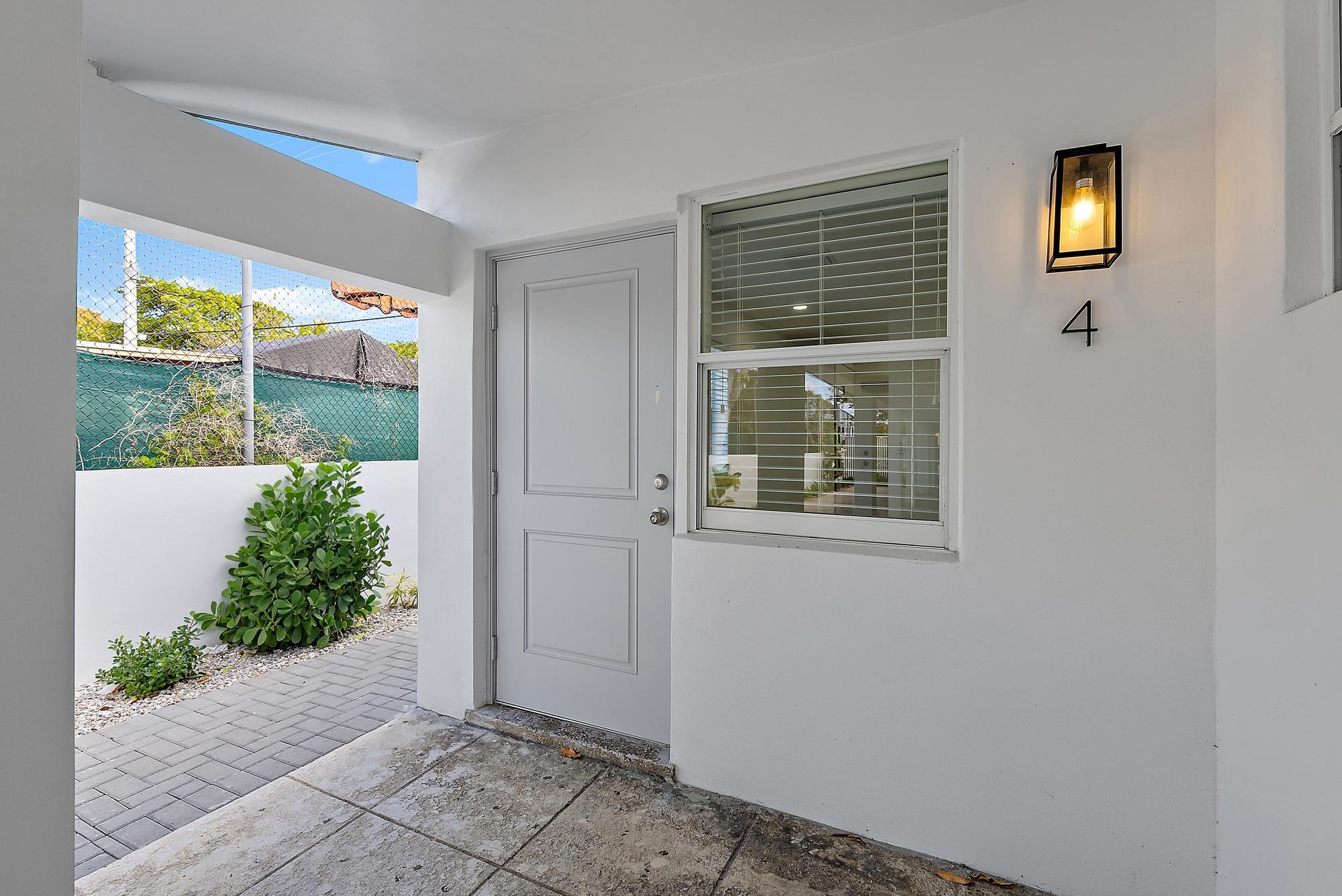 3808 Broadway Avenue West Palm Beach, FL 33407 - Photo 16 of 34 an empty room with a window and garden view