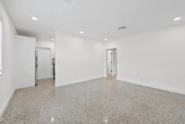 a kitchen with a sink cabinets and appliances