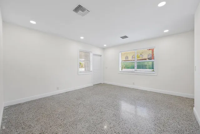 a kitchen with stainless steel appliances granite countertop a stove and a microwave