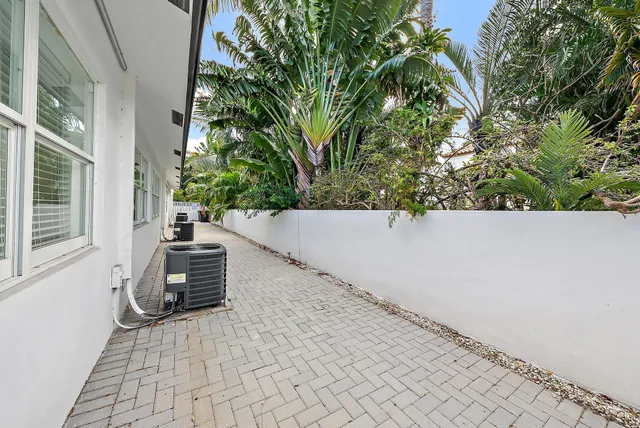 a view of a house with a yard and garage