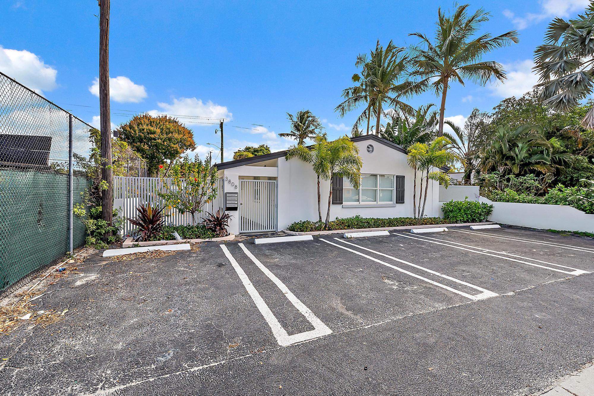 3808 Broadway Avenue West Palm Beach, FL 33407 - Photo 27 of 34 a view of a house with a yard and garage