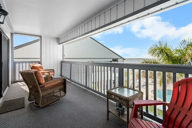 a living room with furniture a rug and a window