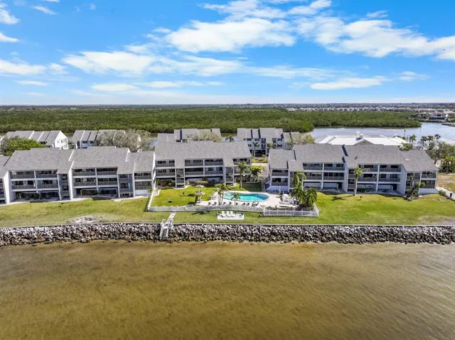 a view of swimming pool with outdoor seating and yard
