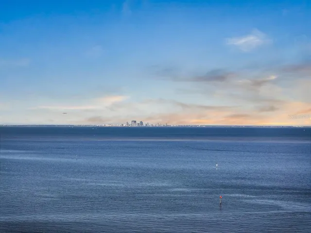 a front view of a building with a garden