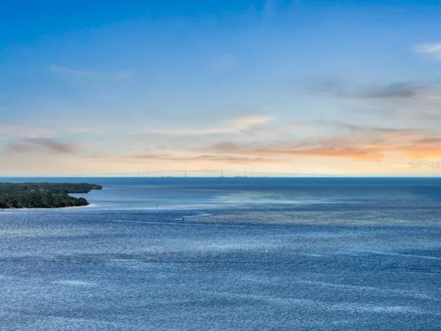 a view of a house with garden and sitting area