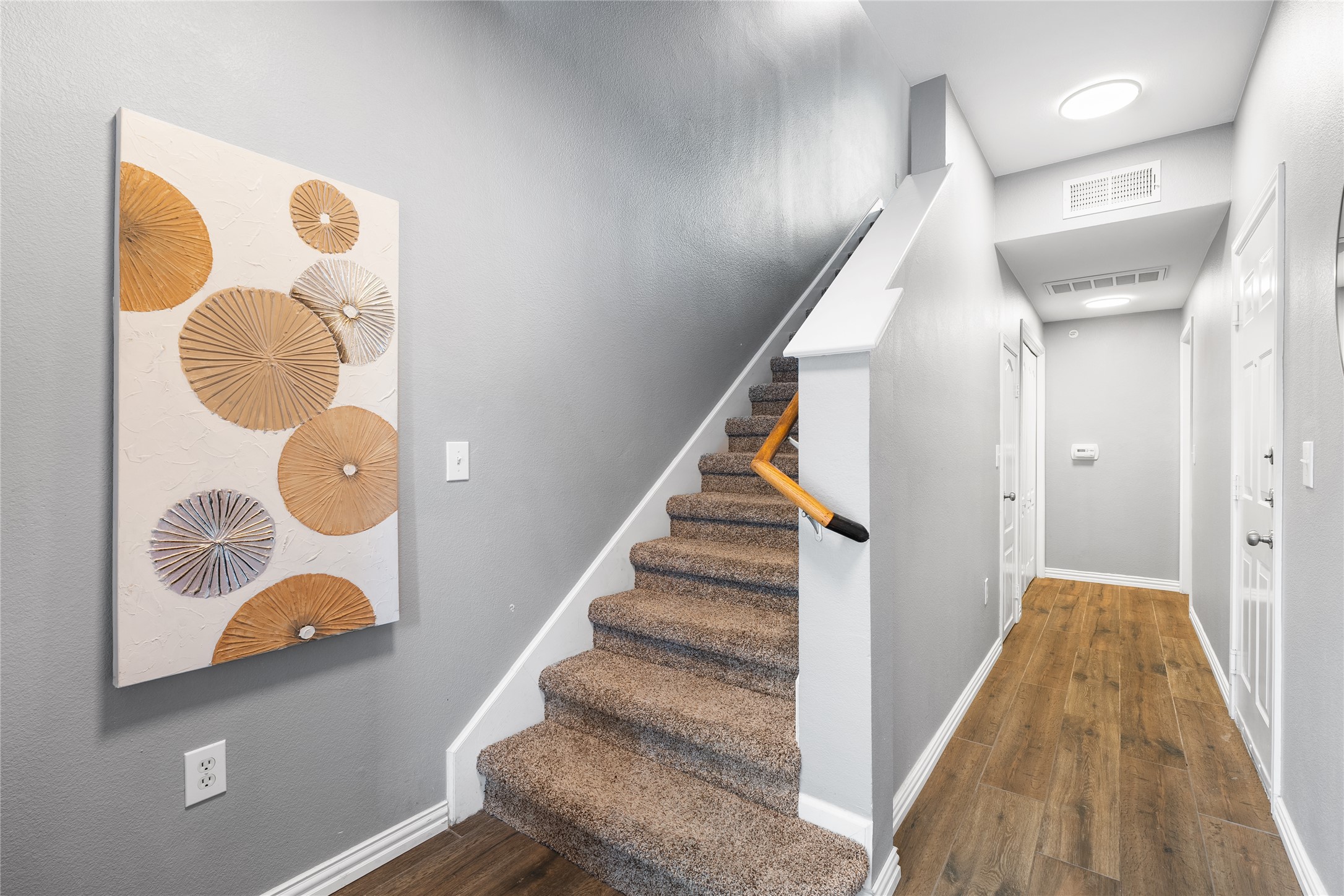 11203 Ranch Road 2222, Unit 1402 Austin, TX 78732 - Photo 15 of 22 Entry view of staircase leading to the living area on the second floor