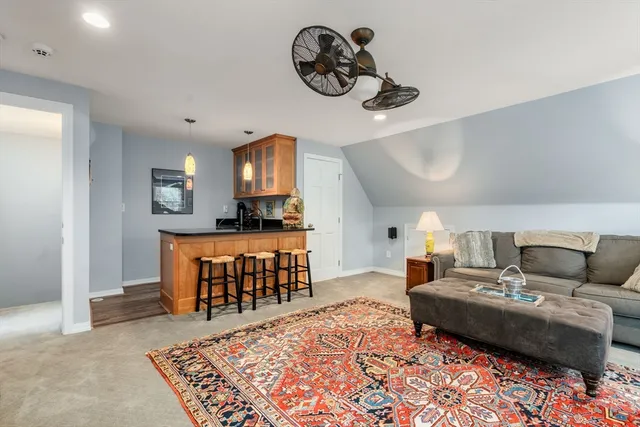 a living room with furniture and a rug