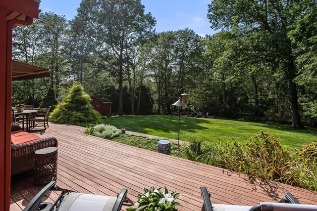 a view of a backyard with sitting area