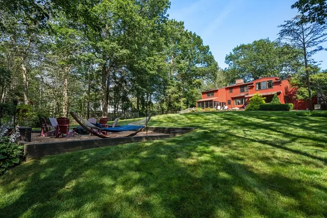 a view of a park with large trees