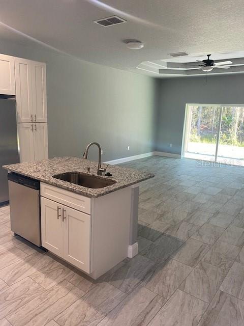 8 Llosee Court, Unit A Palm Coast, FL 32164 - Photo 13 of 21 a kitchen with kitchen island granite countertop a sink and a stove top oven