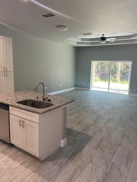 8 Llosee Court, Unit A Palm Coast, FL 32164 - Photo 14 of 21 a kitchen with a sink cabinets and window