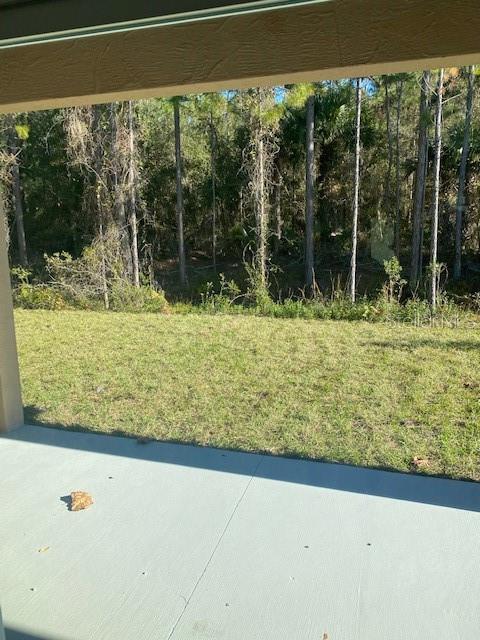 8 Llosee Court, Unit A Palm Coast, FL 32164 - Photo 17 of 21 a view of a backyard of the house