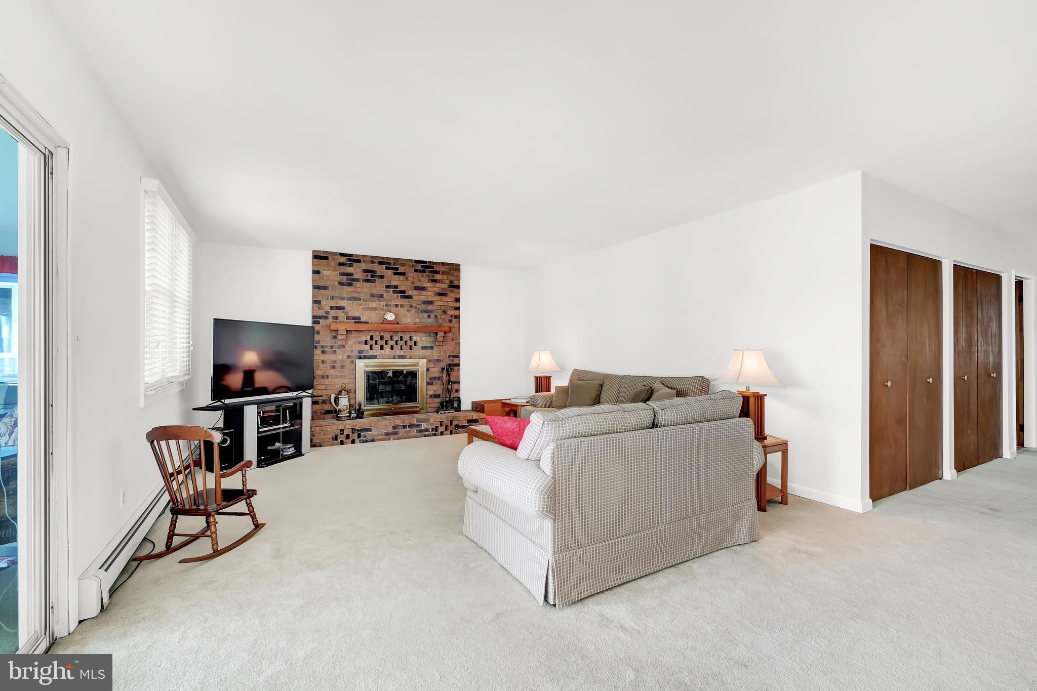 4218 Lynhurst Road Baltimore, MD 21222 - Photo 8 of 27 living room with wood burning fireplace