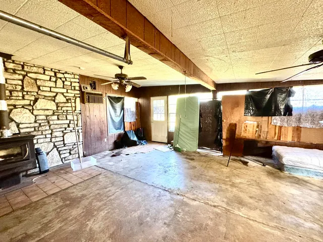 a living room with lots of furniture and white walls
