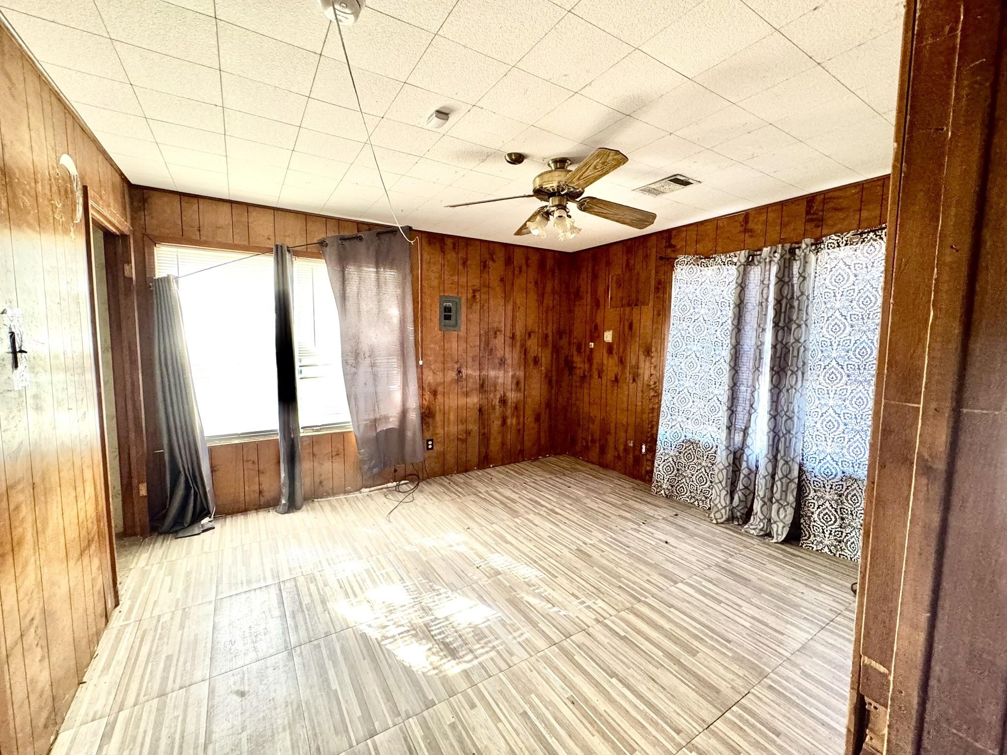 520 Munson Tow, TX 78672 - Photo 14 of 24 a view of a bedroom with wooden floor and a window