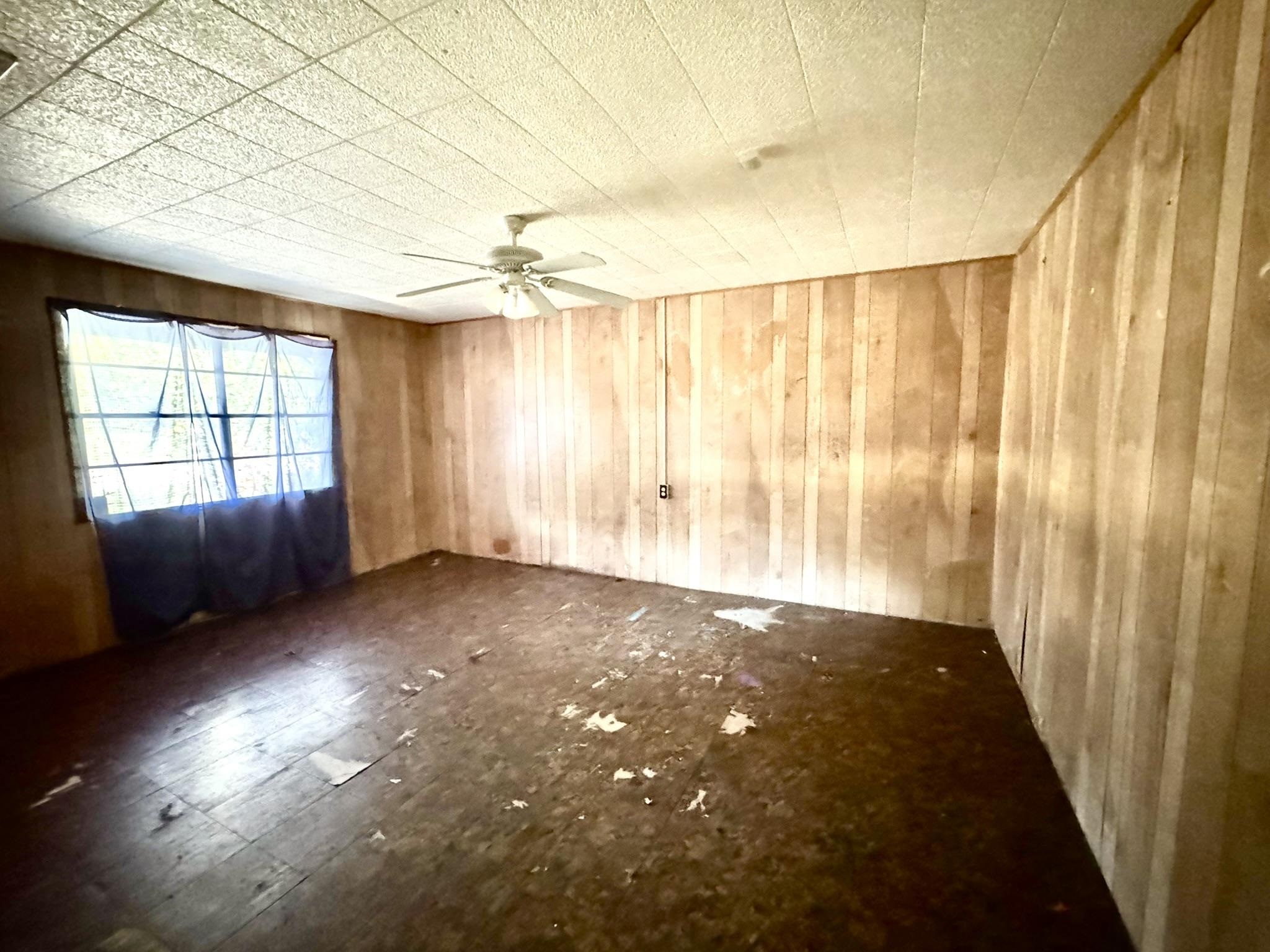 520 Munson Tow, TX 78672 - Photo 18 of 24 wooden floor in an empty room with a window