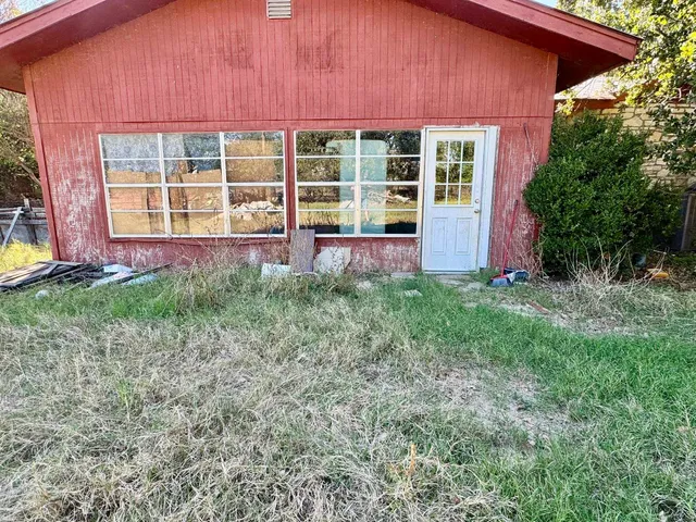 a kitchen with refrigerator and stove