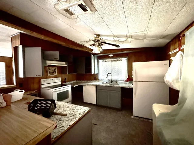 a bathroom with a shower and a sink