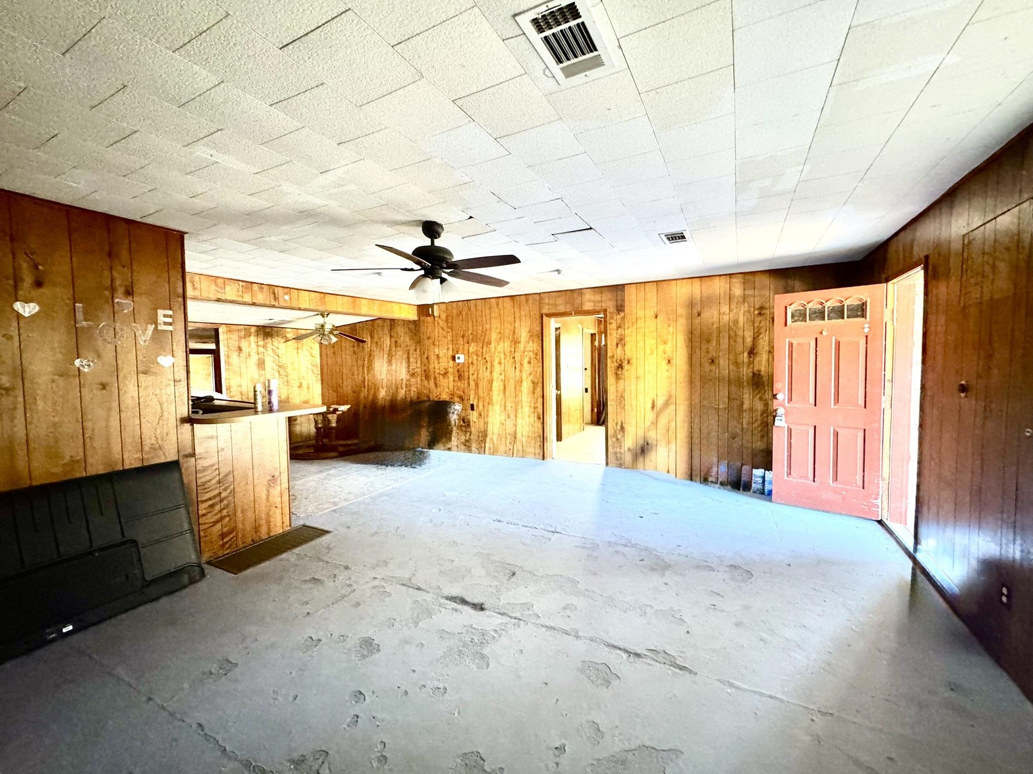 520 Munson Tow, TX 78672 - Photo 3 of 24 a spacious bedroom with a large bed and a chandelier