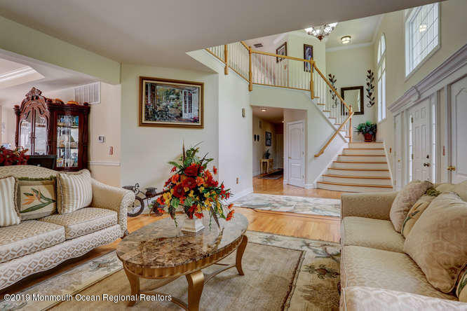 58 Fort Plains Road Howell, NJ 07731 - Photo 2 of 33 a living room with furniture and flowers