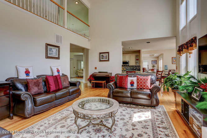58 Fort Plains Road Howell, NJ 07731 - Photo 11 of 33 a living room with furniture and a potted plant